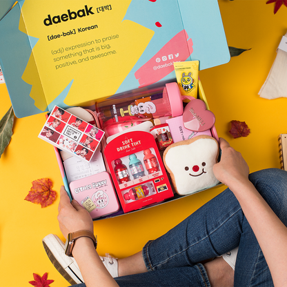 Daebak spring DaebakBox with assorted Korean snacks and treats, featuring colorful packaging and a variety of traditional and modern items.